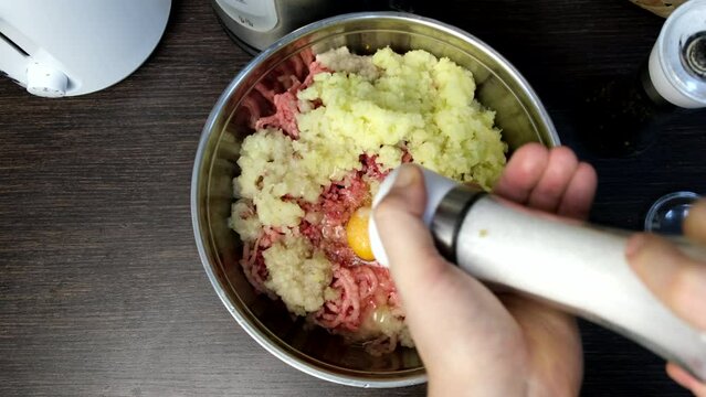 cooking meatballs mixing forcemeat overhead in bowl