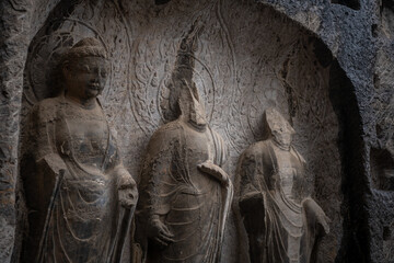 Carved Buddha Limestone at Longmen Grottoes or Caves (Dragon gate Grottoes), The World Heritage Site in Luoyang, Henan province, China. Ancient site