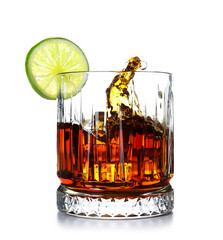 Glass of cold rum with splashes on white background