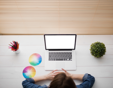 Overhead view of businesswoman using laptop - Powered by Adobe