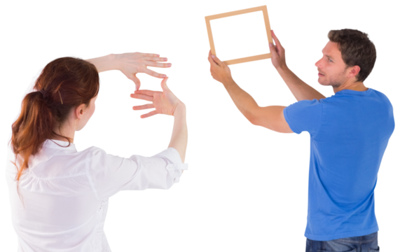 Couple deciding to hang picture