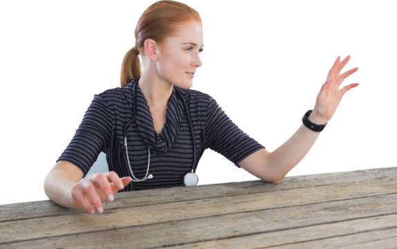 Female doctor touching imaginary screen at table