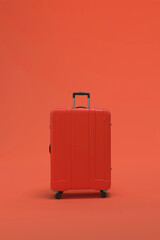 Red Suitcase on pink or magenta background. travel vacations concept.