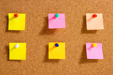 Pinned sticky notes on board