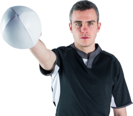 Portrait of serious rugby player holding ball