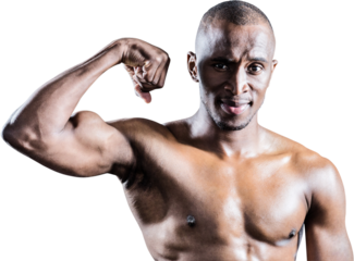 Portrait of muscular man smiling while flexing muscles