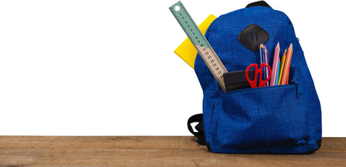 Schoolbag on wooden table