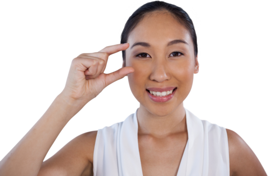 Portrait of happy businesswoman adjusting invisible eyeglasses