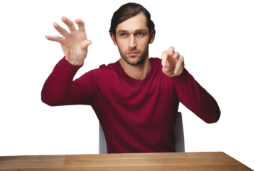 Man gesturing while sitting at desk