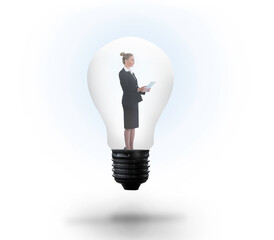 Businesswoman holding tablet in light bulb