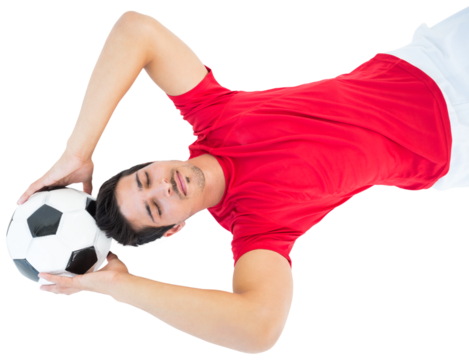 Football player holding football over head