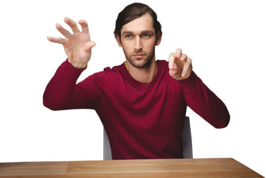 Man gesturing while sitting at desk