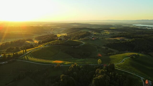 Aerial drone 4K footage of Prlekija in the morning during sunrise. Prlekija is a picturesque region in northeastern Slovenia known for its rolling hills, lush vineyards, and rich cultural heritage.