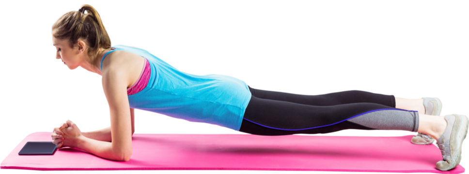Fit woman doing plank on mat