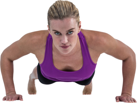 Muscular woman doing push ups 