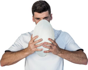 Portrait of serious rugby player holding the ball