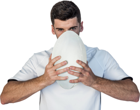 Portrait of serious rugby player holding the ball