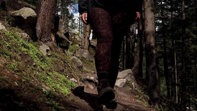 one person walking in the forest -hiking shoes closeup in - Himachal Pradesh - India