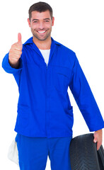 Mechanic with tire gesturing thumbs up