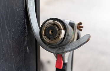 LPG gas nozzle with hose, attached to autogas station column. Gasoline pump stand or fuel dispenser...