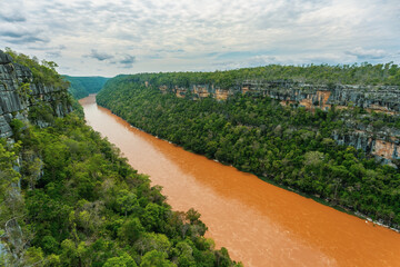 Stunning landscape of Madagascar's Tsingy de Bemaraha National Park, with a breathtaking view of the Manambolo River from a viewpoint.. Madagascar wilderness landscape.