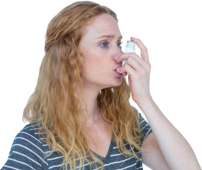 Woman using the asthma inhaler
