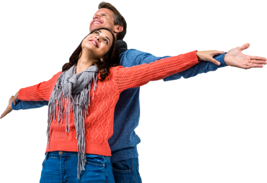 Couple with arms outstretched