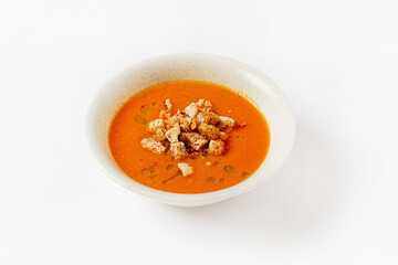 tomato soup with croutons on the white