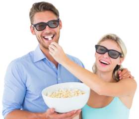 Happy young couple wearing 3d glasses eating popcorn
