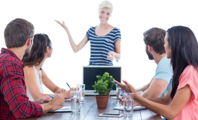 Casual businesswoman giving presentation to her colleagues