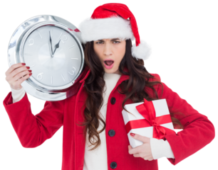 Surprised brunette holding a clock and gift
