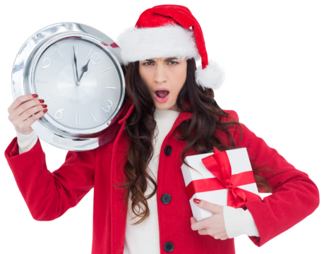 Surprised brunette holding a clock and gift