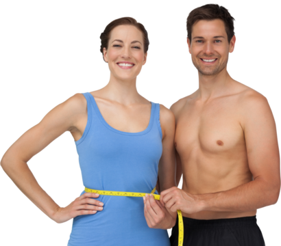 Fit young man measuring womans waist