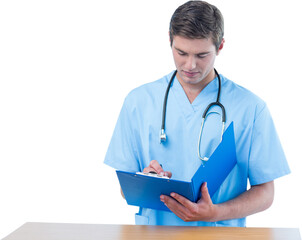 Handsome surgeon writing on clipboard