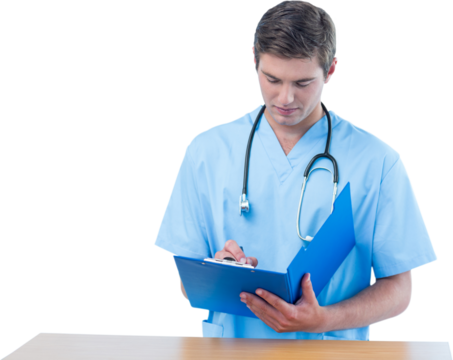 Handsome surgeon writing on clipboard