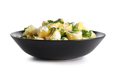 Bowl of tasty Potato Salad with greens on white background