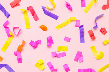 Colorful confetti on pink background