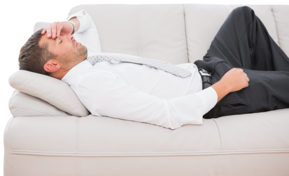 Businessman with headache lying on sofa - Powered by Adobe