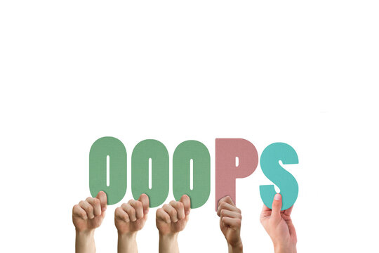 Cropped hands holding colorful word ooops 