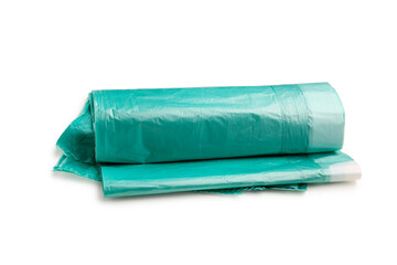 Green roll of garbage bags isolated on white background