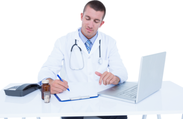 Male doctor writing while sitting by desk