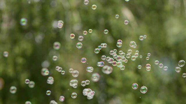 Soap bubbles in the air in slow motion, selective focus