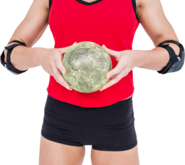 Female athlete with elbow pad holding handball