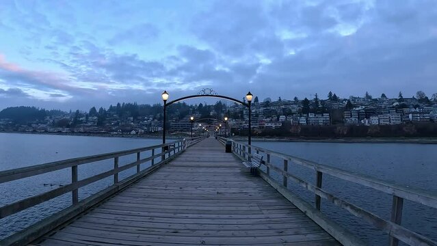 6:50AM on the White Rock Pier, BC, Canada (Longest Pier in Canada). Seagull flying by on the right.