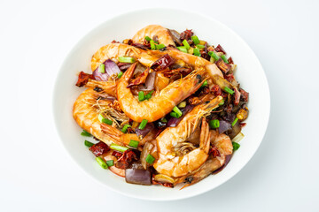 A plate of spicy shrimp on a white background