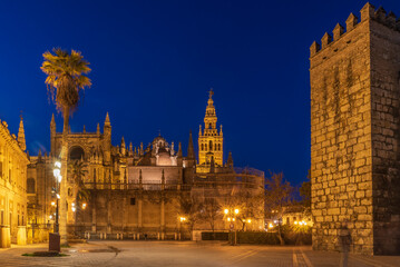 Fototapeta na wymiar Seville Cathedral is the third largest church in the world and one of the beautiful examples of Gothic and baroque architectural styles and Giralda the bell tower of is 104.1 meters high 