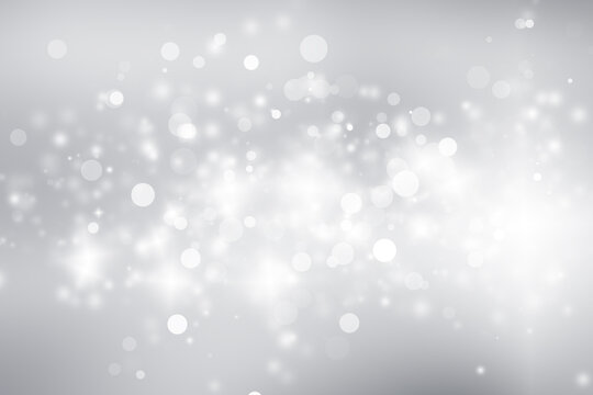 white and gray blur abstract background. bokeh christmas blurred beautiful shiny Christmas lights.