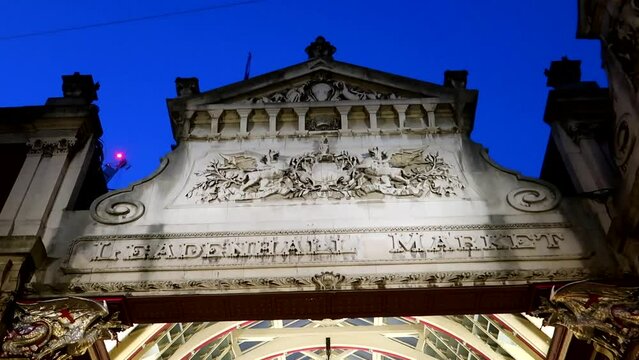 Leadenhall Market facade with inscriptions at night, London. Static shot