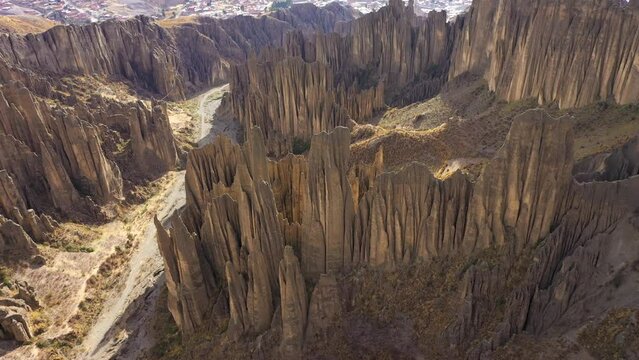 Valle de las Animas Spires and Rock Formations. La Paz, Bolivia. Aerial View. Drone Flies Forward, Tilt Down