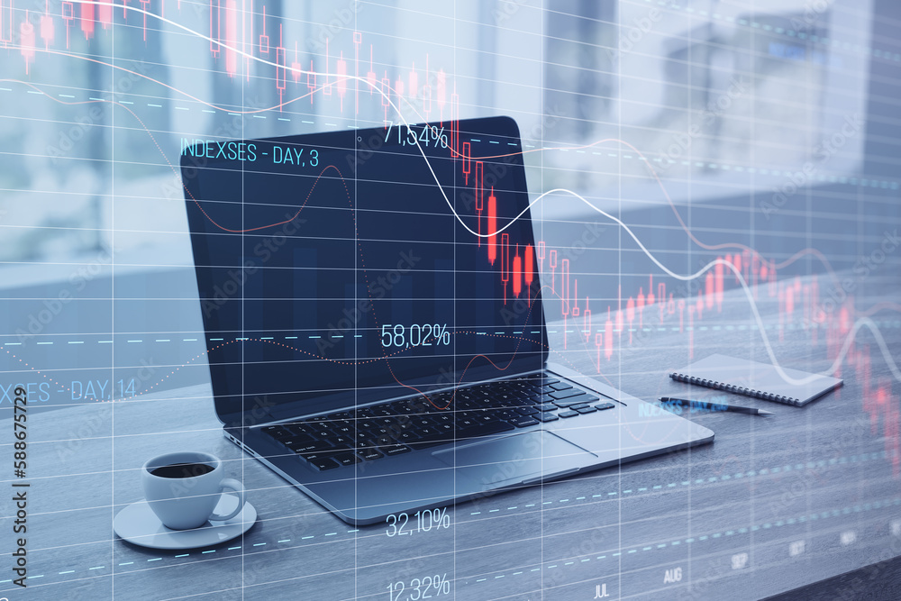 Poster close up of laptop computer on desktop with coffee cup and falling red crisis forex chart on screen.